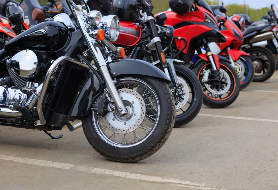 a row of motorcycles in a parking lot